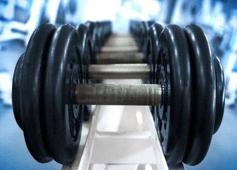 dumbbell on blue background