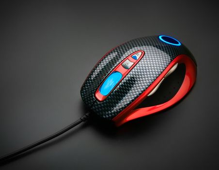 Stylish optical mouse, on black background