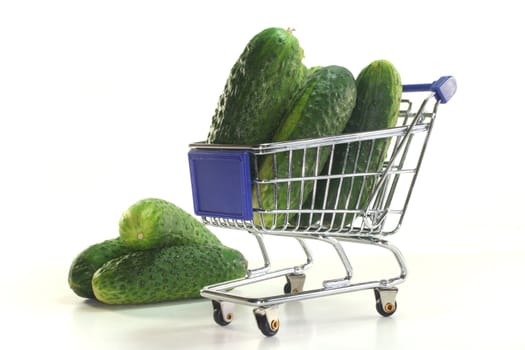 Gherkins in a shopping cart on a white background