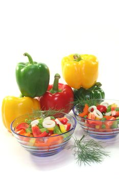 colorful bell pepper salad with dill in small glass bowls