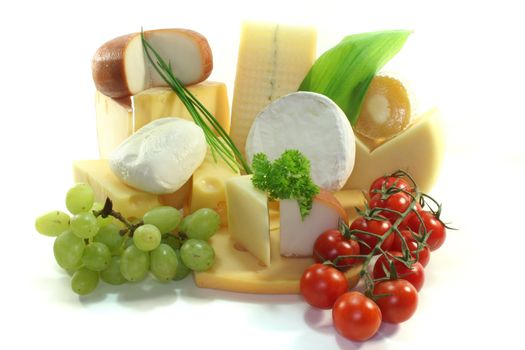 various Cheese with fresh grapes and tomatoes