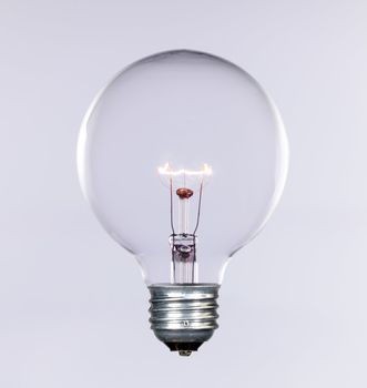 Glass incandescent tungsten filament light bulb due to be replaced due to energy concerns