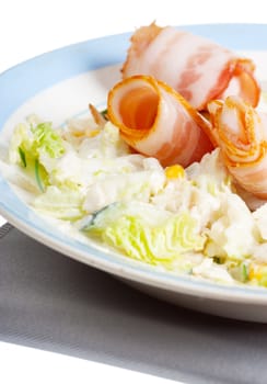 Macro view of salad and ham rolls