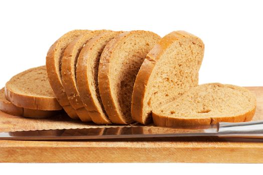 Knife and bread on a wood board