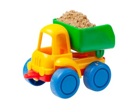 Colorful toy truck with sand isolated over white background