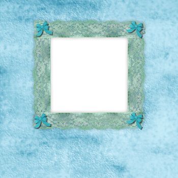picture frame of old lace with blue ribbons