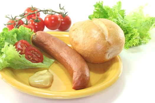Frankfurter sausages with bread and salad on a white background