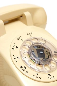 A closeup shot of a traditional rotary phone.