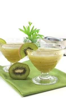 Green jelly with fresh kiwi and woodruff