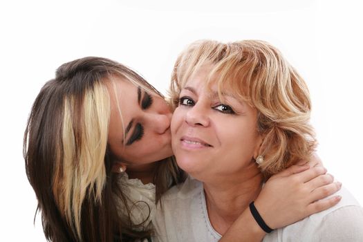 Closeup of young girl kissing her mom isolated on a white background