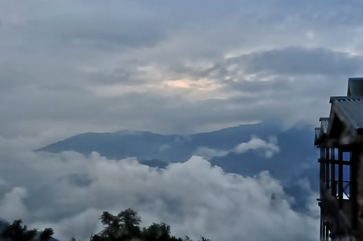 Sea of clouds,blue mountain,cottage, bush,storm clouds,