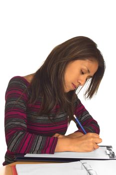 Young Peruvian woman writing with a pencil on white paper (Selective Focus, Focus on the eye and the pencil) 