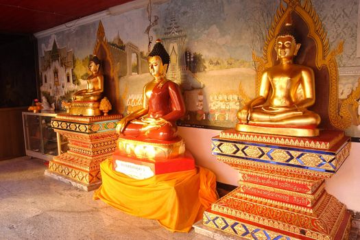 Golden Buddhas in Temple at Chiangmai, Thailand. 