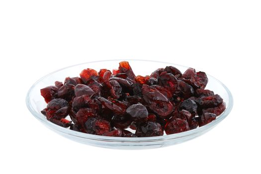 Dried cranberries on glass plate isolated on white background