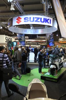 Looking at Suzuki new motorcycles during EICMA 2011, International Motorcycle Exhibition.