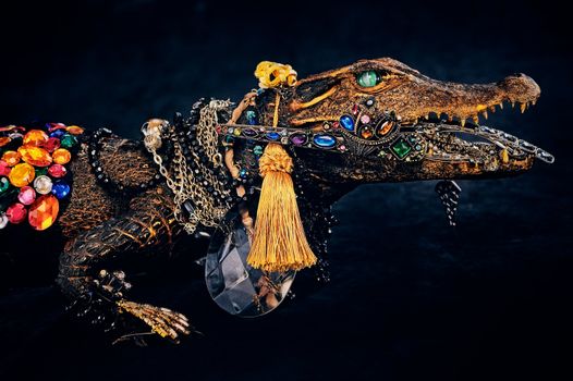 Vintage bijouterie hang on the stuffed crocodile