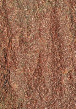 Close up of natural rough brown stone background
