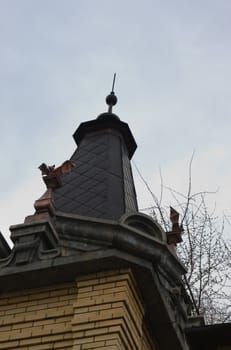 roof of the tower is decorated with sculptures