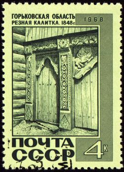 USSR - CIRCA 1968: A post stamp printed in USSR and shows old russian wooden wicket with carving decoration in Nizhny Novgorod region of Russia, series, circa 1968