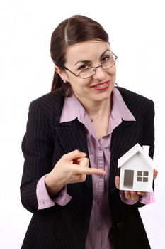Young woman holding  house model. Real estate concept 