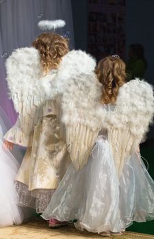 
Two little girl wearily as an angel.