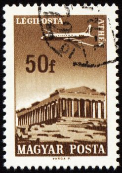 HUNGARY - CIRCA 1966: A stamp printed in Hungary shows flying plane over the Athens, series, circa 1966