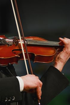 Musician playing violin with expression