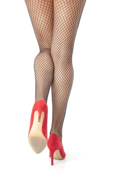 Sexy woman legs in fishnet stocking posing