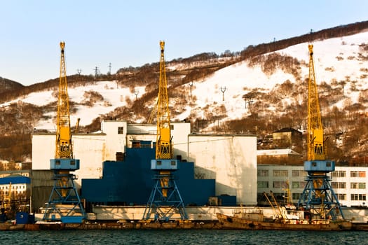 Elevating cranes in port on Kamchatka in Russia