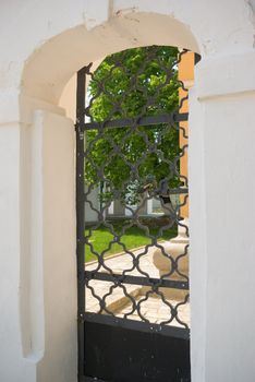 A view to the old courtyard through a gate 