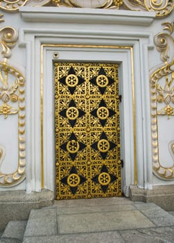 An ancient wooden door with wrought iron ornaments