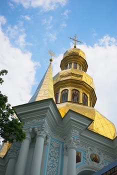 Domes of orthodox church on a blue sky background.