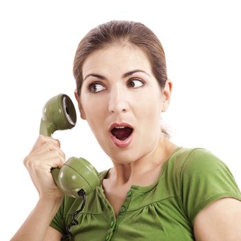 Beautiful woman at phone astonished with something