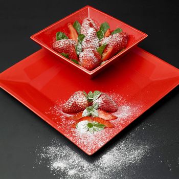 sugared strawberries with mint leaves