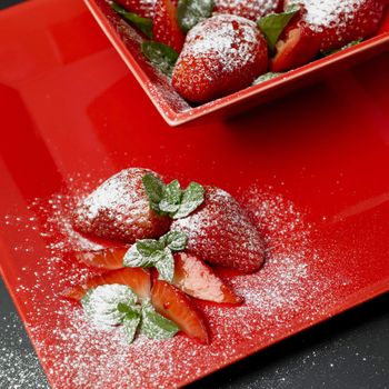 sugared strawberries with mint leaves