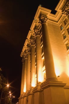 Columns of a building. A night photo, light from street lanterns