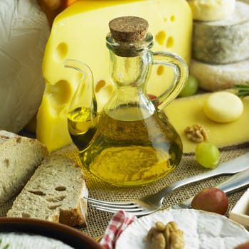 cheese still life with olive oil