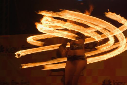 fire-show, woman in action with fire