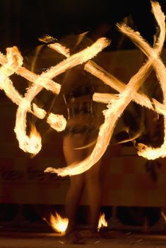 fire show, woman in action with fire