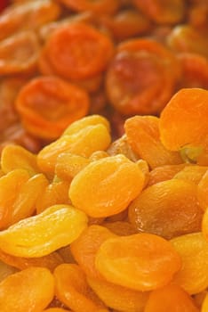 Dry apricots arranged at the background