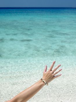hand with shell bracelet, Maria la Gorda Beach, Pinar del Rio Province, Cuba