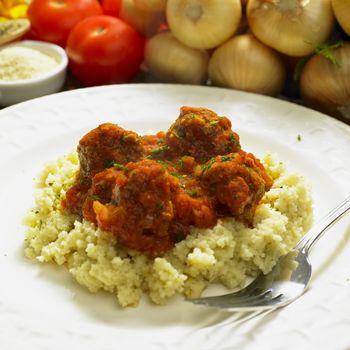 meat balls with couscous in tomato sauce