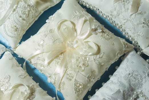 An image of floral arrangements located on seats at a wedding ceremony