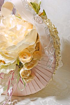 An image of floral arrangements located on seats at a wedding ceremony 