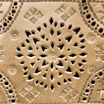 Arabic handicraft product pattern craftet in a golden leather.