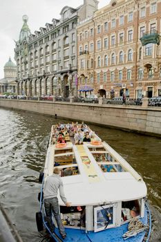 Tourist boat in the channel of St Petersburg, Russia