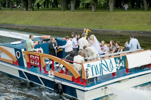 Traditional wedding boat trip in chanels of St petersburg, Russia