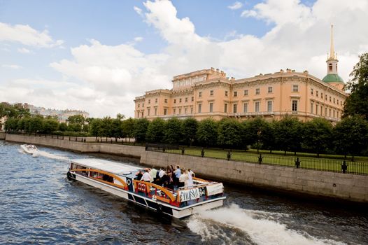 Tourist boat in the channel of St Petersburg, Russia