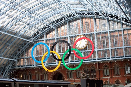 London, United Kingdom - June 8, 2011: The Olympic rings at St Pancras International Rail Station on June 8, 2011. This station is the terminus of trains in the UK and in France with Eurostar. The huge Olympic rings greet passengers in preparation for the London 2012 Olympics.