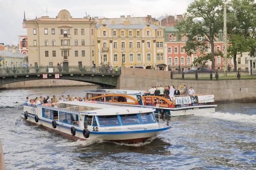 Tourist boat in the channel of St Petersburg, Russia